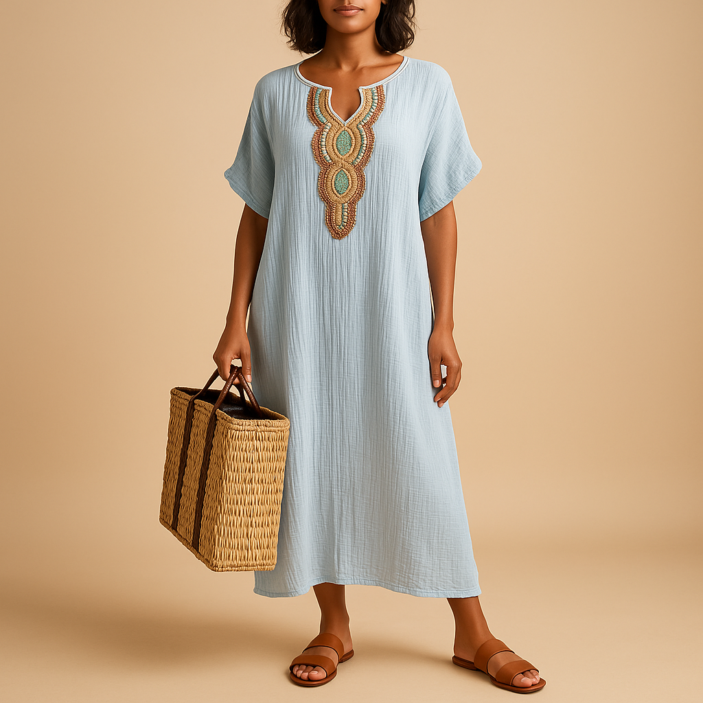 Light kaftan dress for women with a flowy fit and breathable fabric, perfect for summer beach days and elegant occasions.