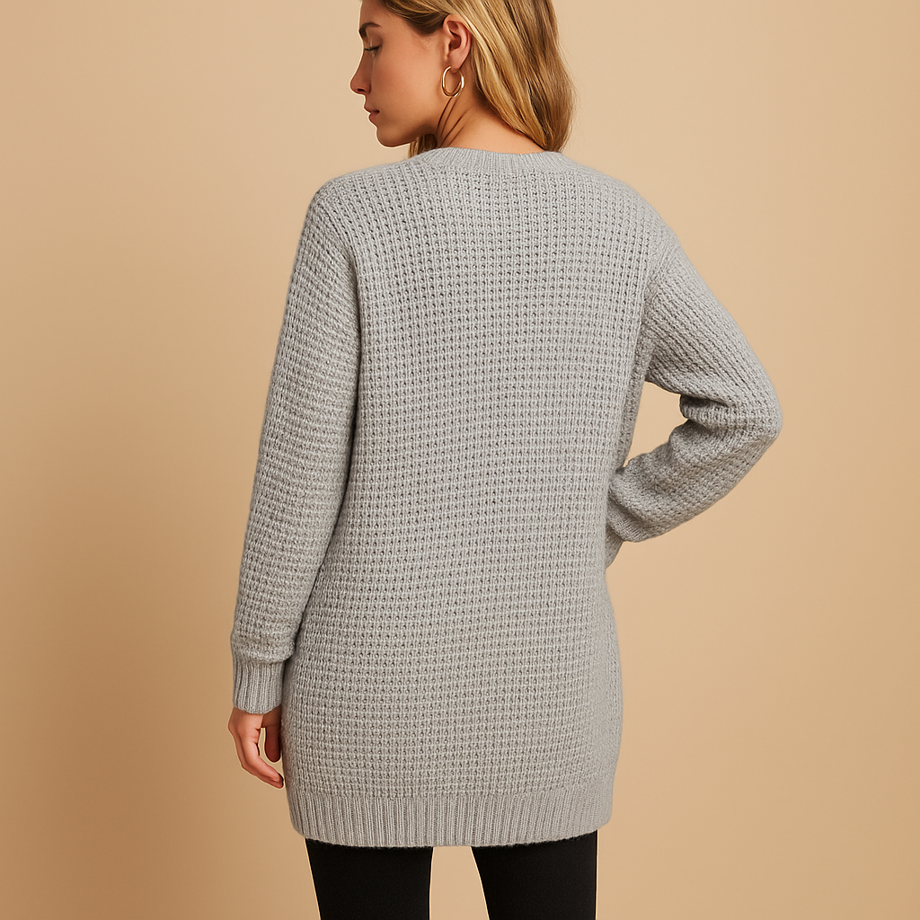 Long cardigan with v-neck for women featuring a relaxed fit, practical pockets, and soft breathable fabric. Perfect for casual or office wear.