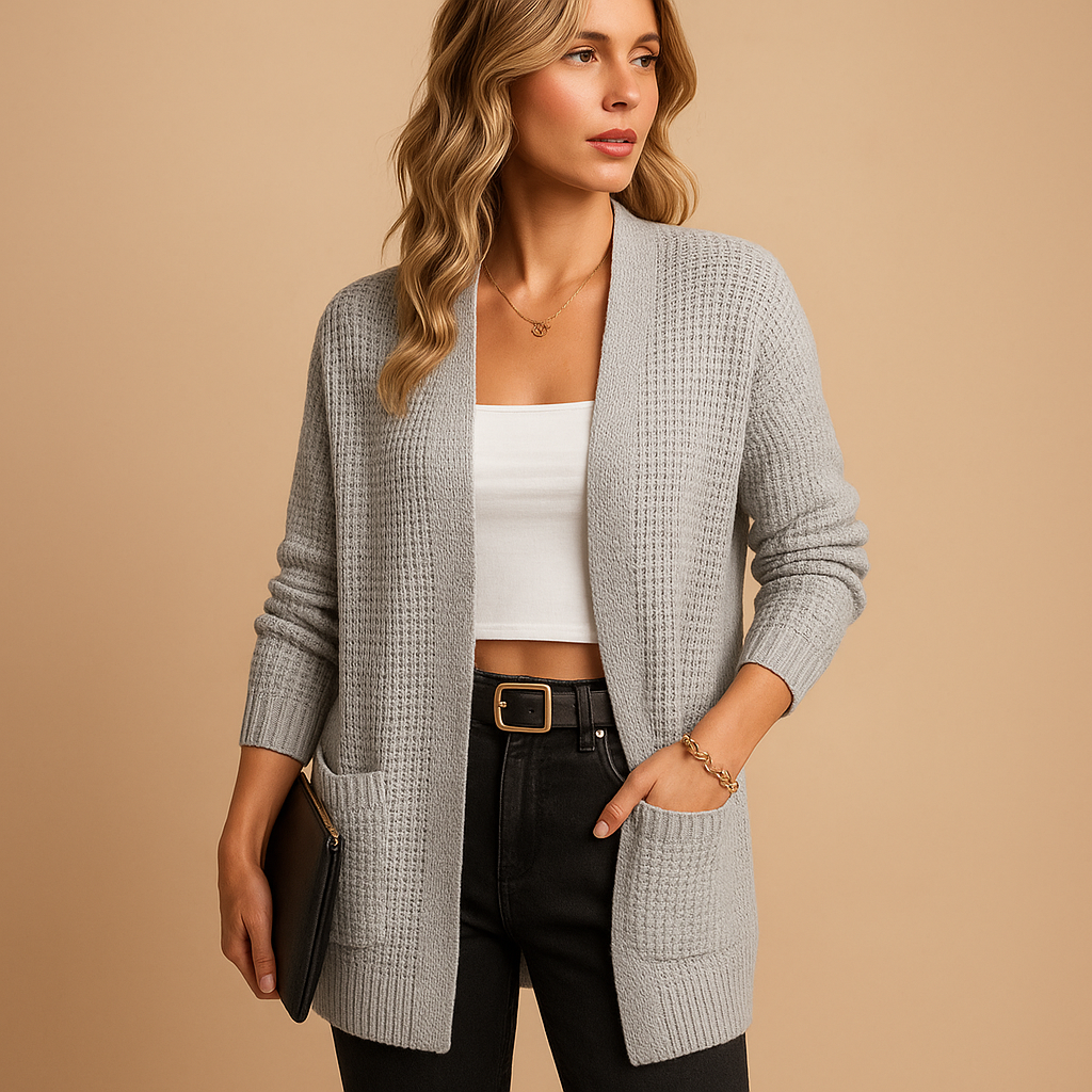 Long cardigan with v-neck for women featuring a relaxed fit, practical pockets, and soft breathable fabric. Perfect for casual or office wear.
