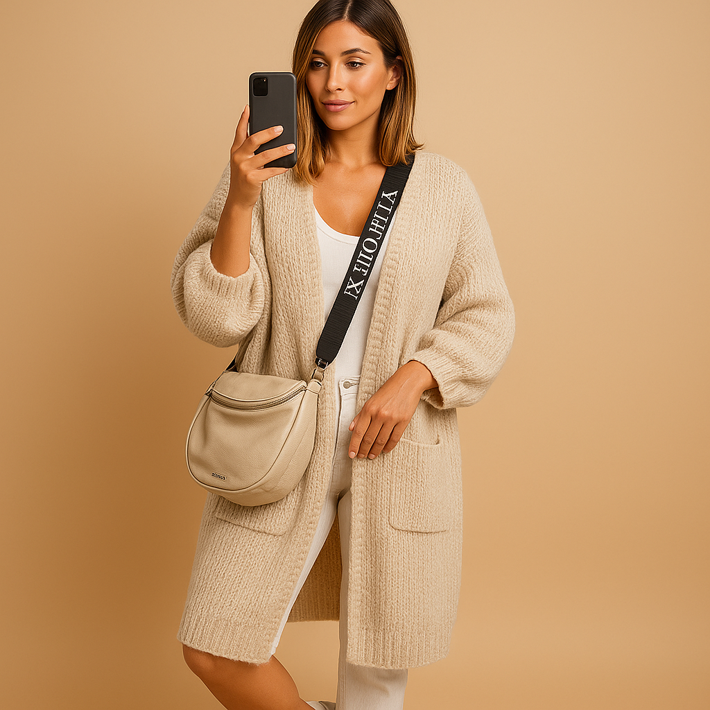 Women’s oversized open cardigan with loose fit, open front, and refined details. Lightweight and versatile for casual chic layered outfits.