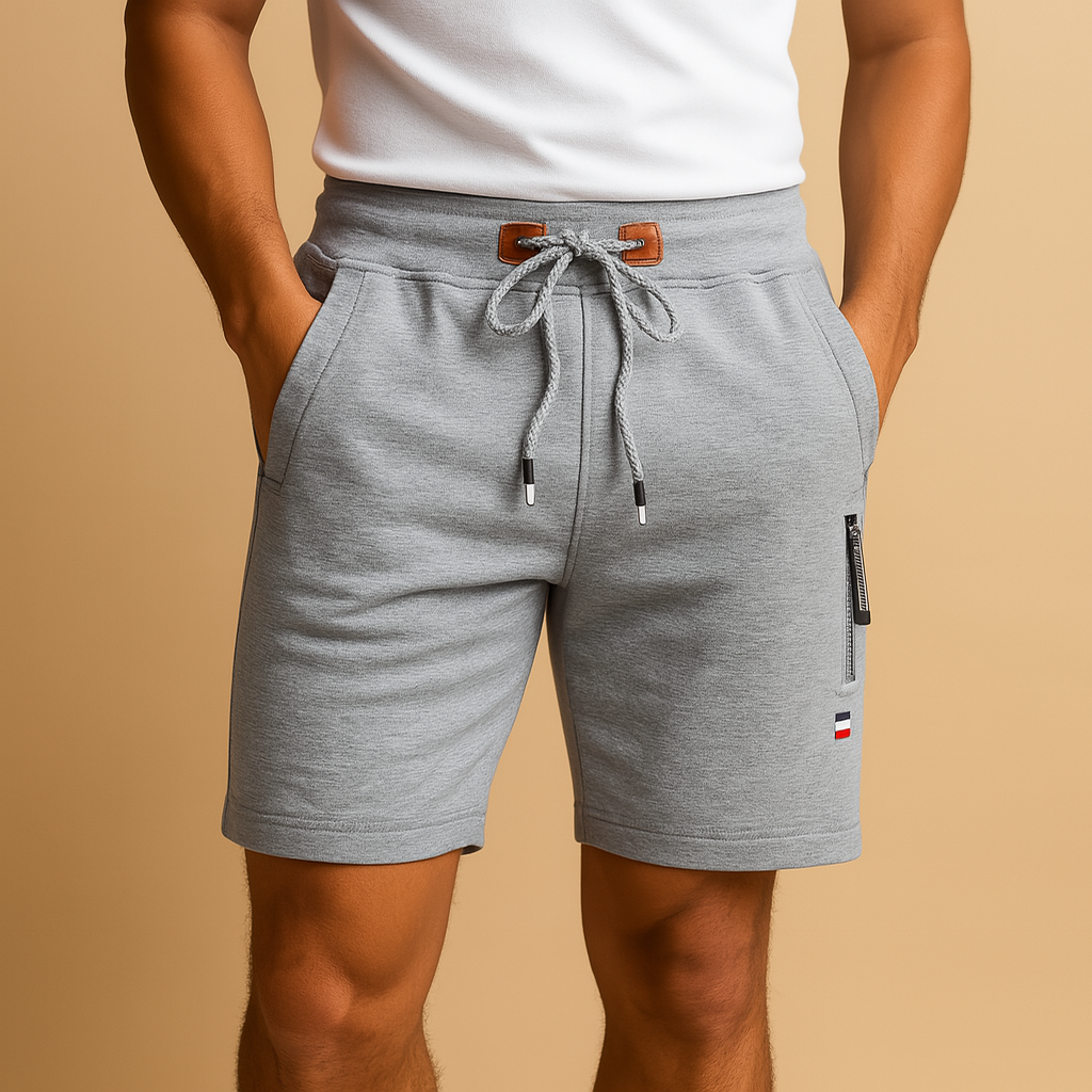 Men’s breathable sports shorts with elastic waistband, multiple pockets, and lightweight design, perfect for daily wear, travel, and outdoor activities.