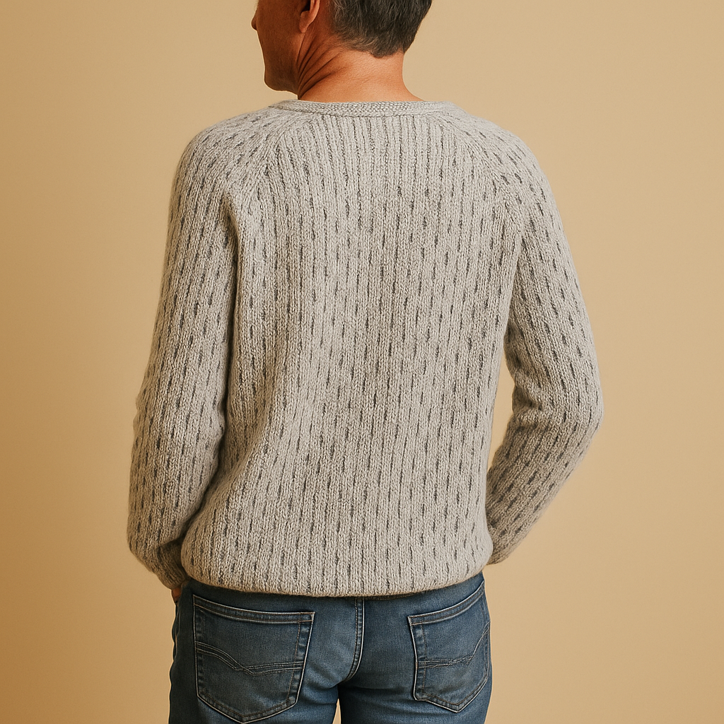 Women’s elegant knitted winter sweater in timeless grey with relaxed fit, breathable fabric, and classic design for casual or office wear.