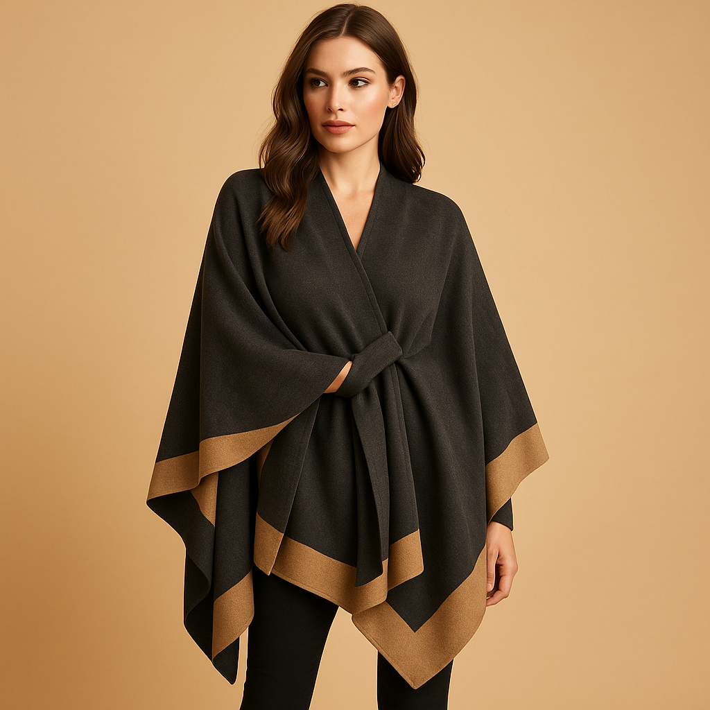 Women’s elegant poncho with flowing silhouette, open sides, and soft faux cashmere feel. Ideal for autumn and winter layered outfits.