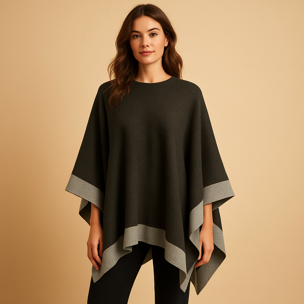 Women’s elegant poncho with flowing silhouette, open sides, and soft faux cashmere feel. Ideal for autumn and winter layered outfits.