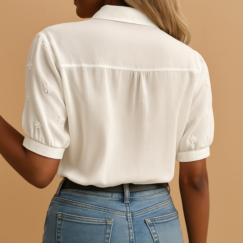 Women’s elegant white blouse with classic collar and button closure, perfect for office wear, casual outings, or evening occasions.