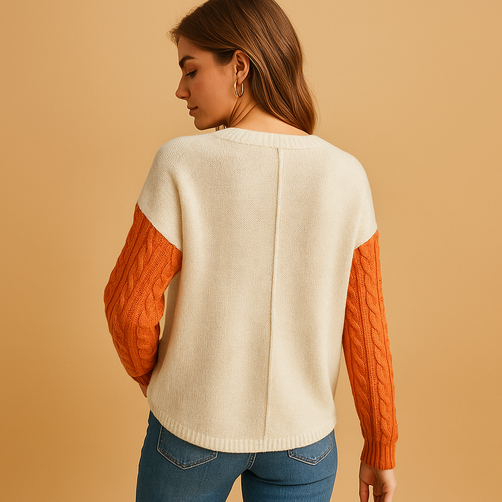 Women’s knit sweater with cable pattern, dropped shoulders, and pocket detail. Relaxed fit, versatile style, perfect for casual or cozy outfits.