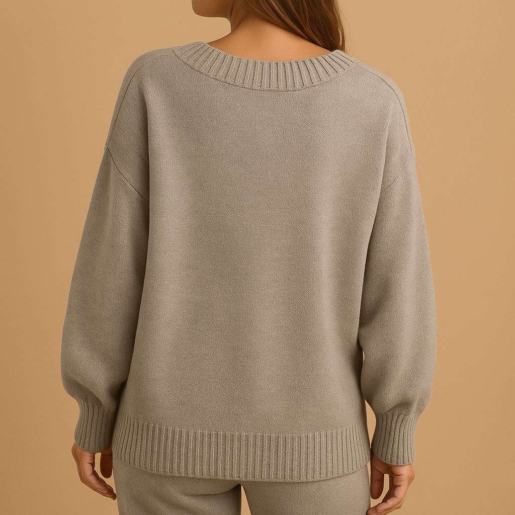 Women’s knit V-neck sweater in neutral tones with a slim, comfortable fit. Perfect for everyday wear, office looks, and layered outfits.