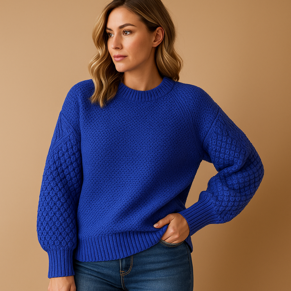 Women’s knitted winter sweater with tailored relaxed fit, soft lightweight fabric, and minimalist design in neutral tones for casual or formal wear.