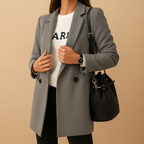 Women’s long elegant jacket with classic silhouette, refined finish, and flattering cut. Available in neutral tones for versatile seasonal wear.
