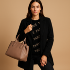 Women’s long elegant jacket with classic silhouette, refined finish, and flattering cut. Available in neutral tones for versatile seasonal wear.