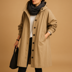 Women’s long waterproof raincoat with breathable fabric, adjustable waist, removable hood, and belt. Available in Green, Beige, and Black.