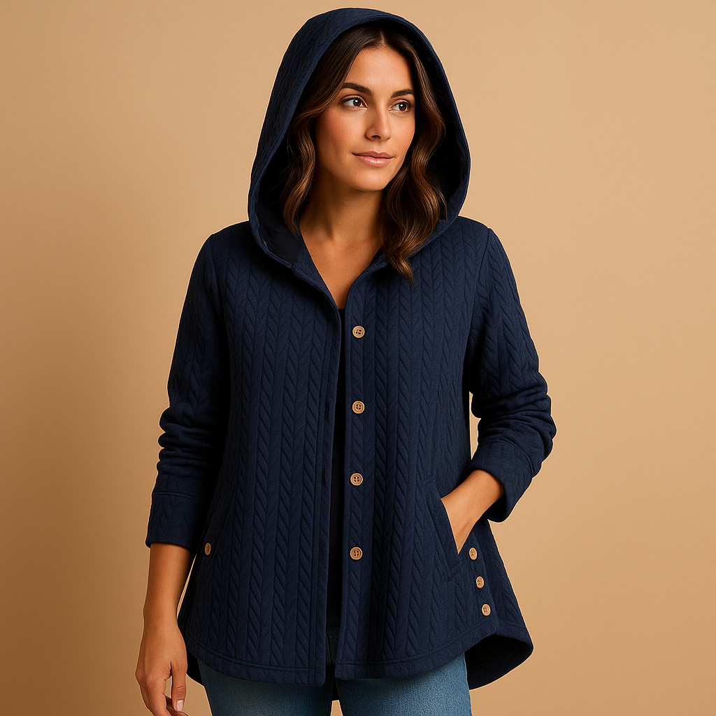 Long winter coat for women with hood, button closure, and extended fit. Made from durable warm fabric in elegant seasonal colors.