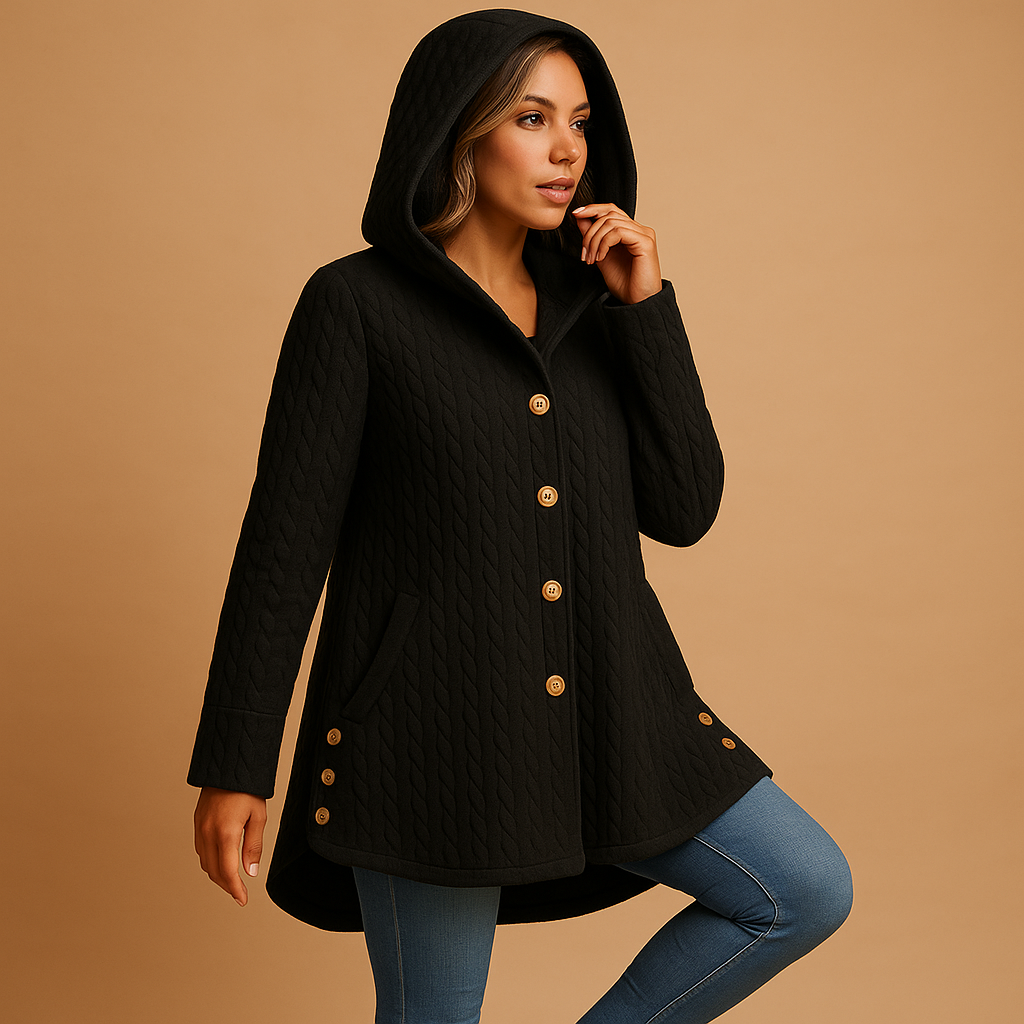 Long winter coat for women with hood, button closure, and extended fit. Made from durable warm fabric in elegant seasonal colors.