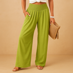 Women’s loose summer pants with elastic waistband and wide straight legs, lightweight breathable fabric, perfect for casual summer days.