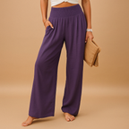 Women’s loose summer pants with elastic waistband and wide straight legs, lightweight breathable fabric, perfect for casual summer days.
