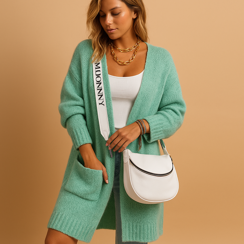 Women’s oversized open cardigan with loose fit, open front, and refined details. Lightweight and versatile for casual chic layered outfits.