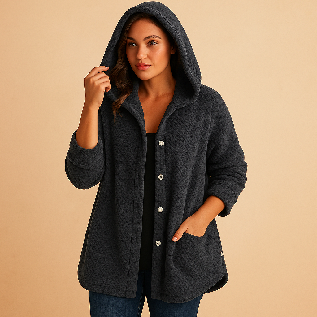 Winter coat with hood for women in breathable water-repellent fabric with insulated lining, flattering fit, and protective design.